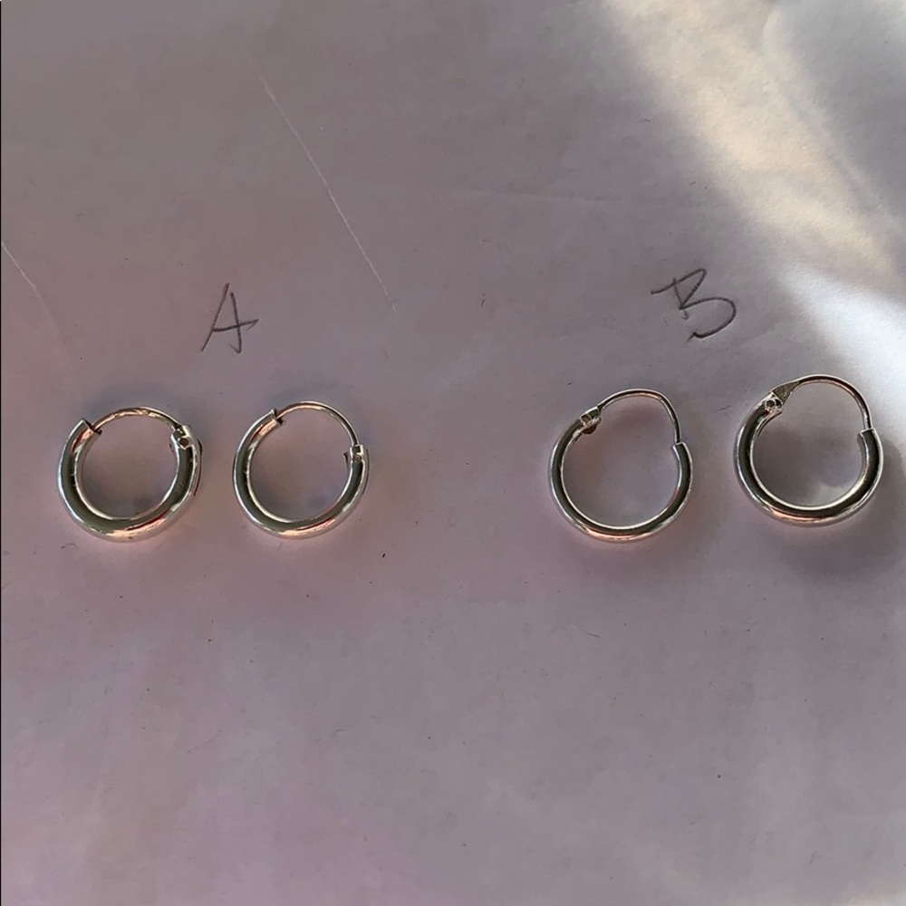 Sterling silver 10mm hoops.  “A”